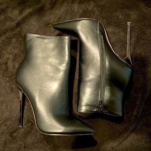 Brand New Black Stiletto booties, 5 inch chrome heels  faux fur lining in size 9